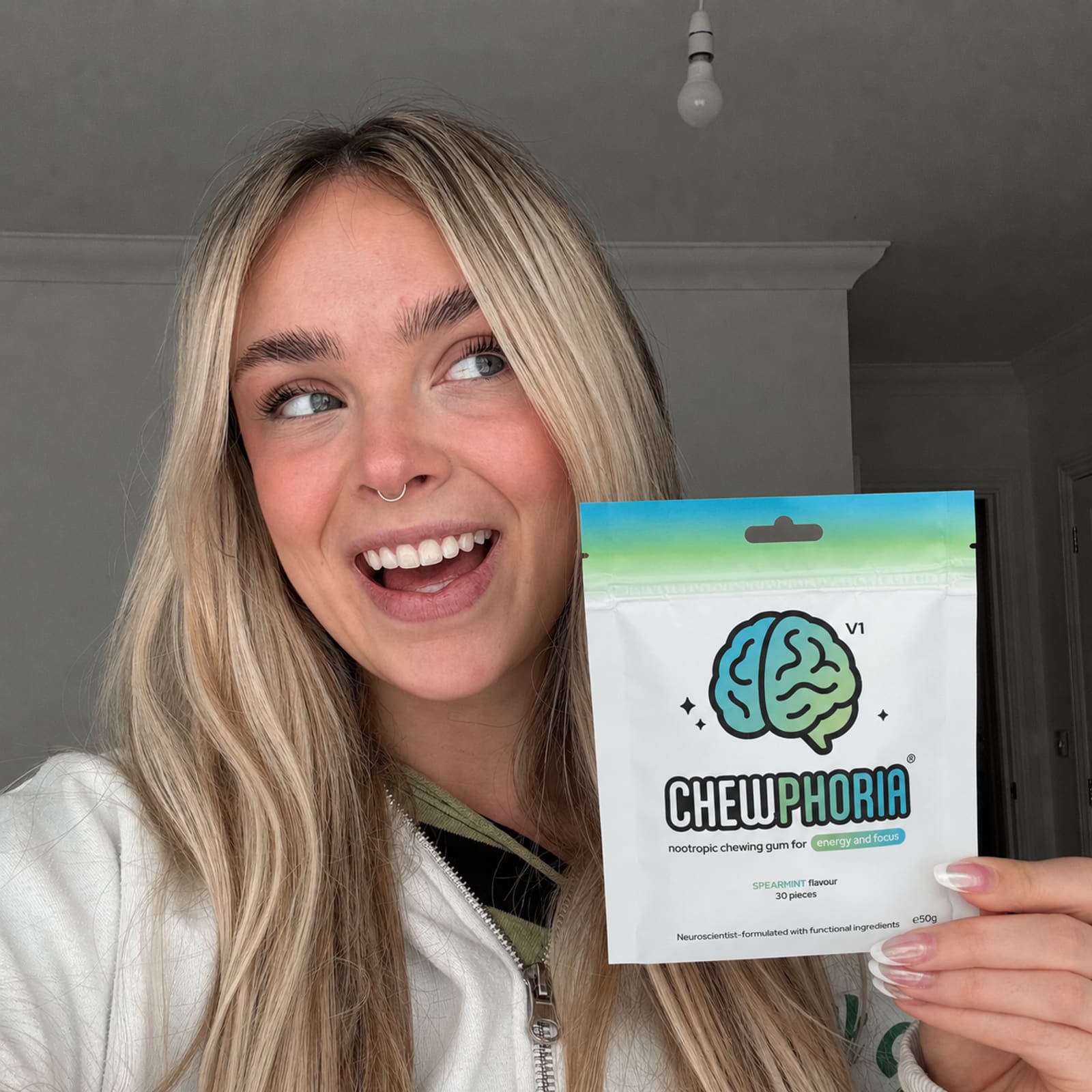 A real Chewphoria customer holding the pouch